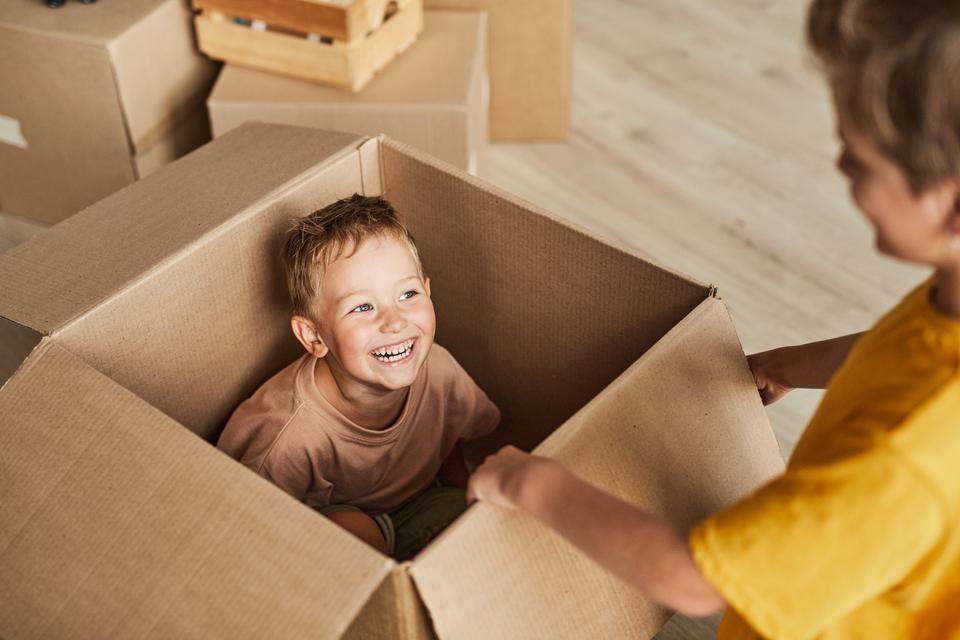 5. pix kid playing w box 1